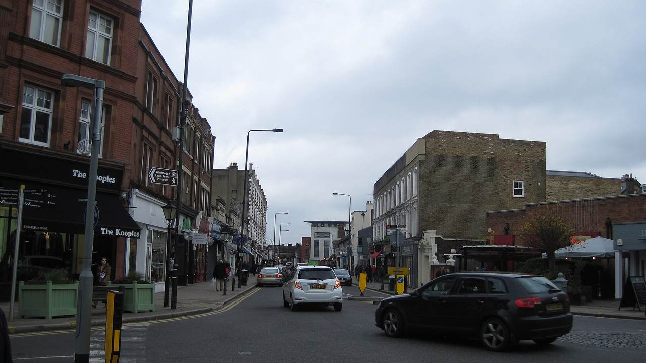 Wimbledon Village High Street, with period shopfronts and the road running towards the top of Wimbledon Hill Road
